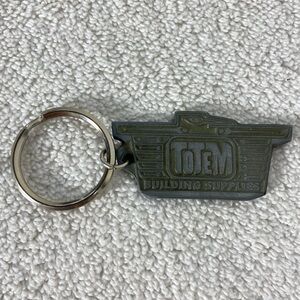 5/$35 Vintage Totem Building Supplies Metal Keychain